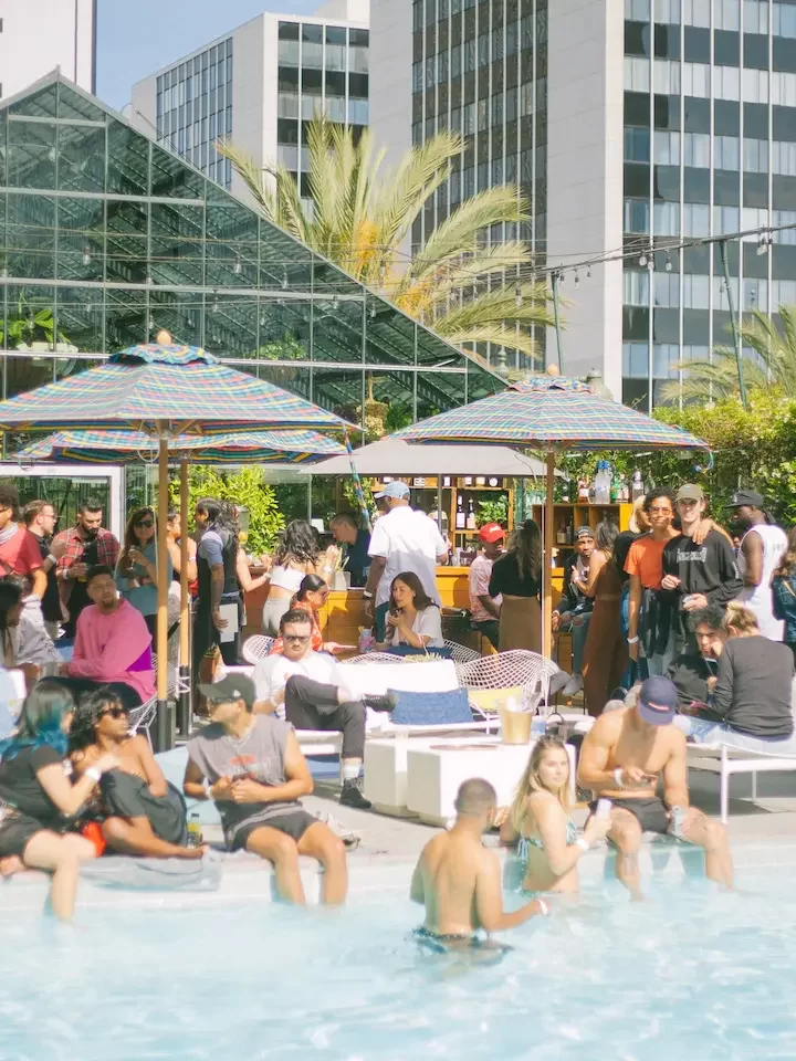 People standing near pool and relaxing