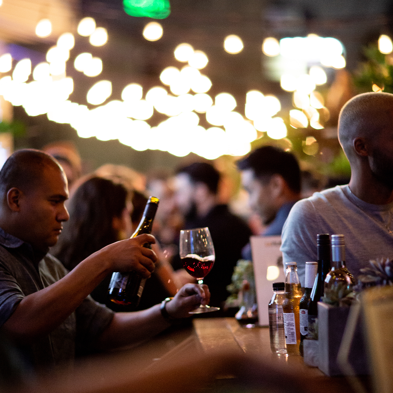 Man pouring drink into the glass