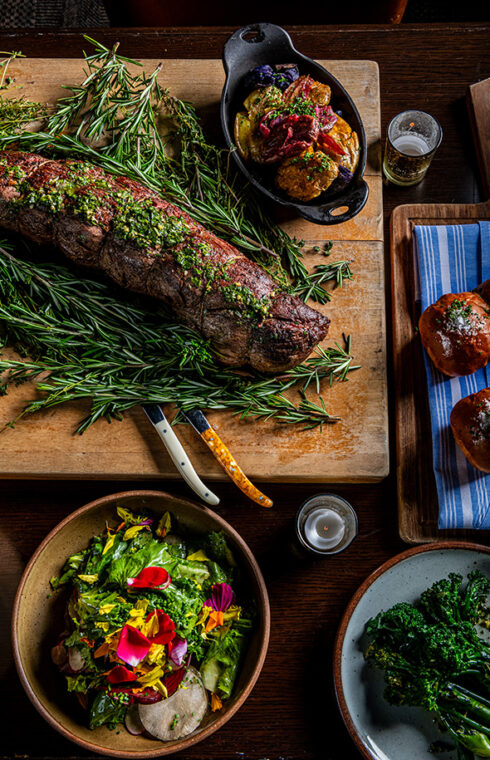 Multiple plated food with garnishes