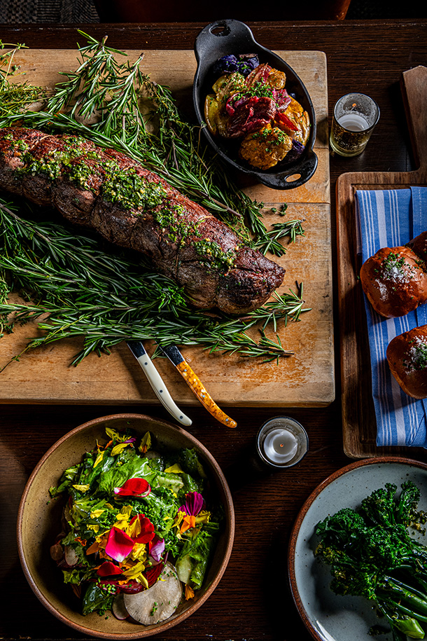 Multiple plated food with garnishes