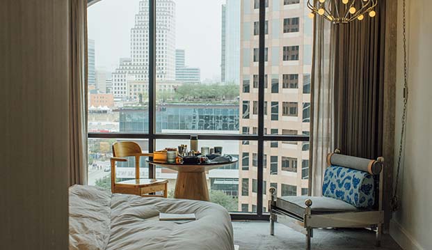 Hotel Room with Sofa and Bed and Transparent glass window